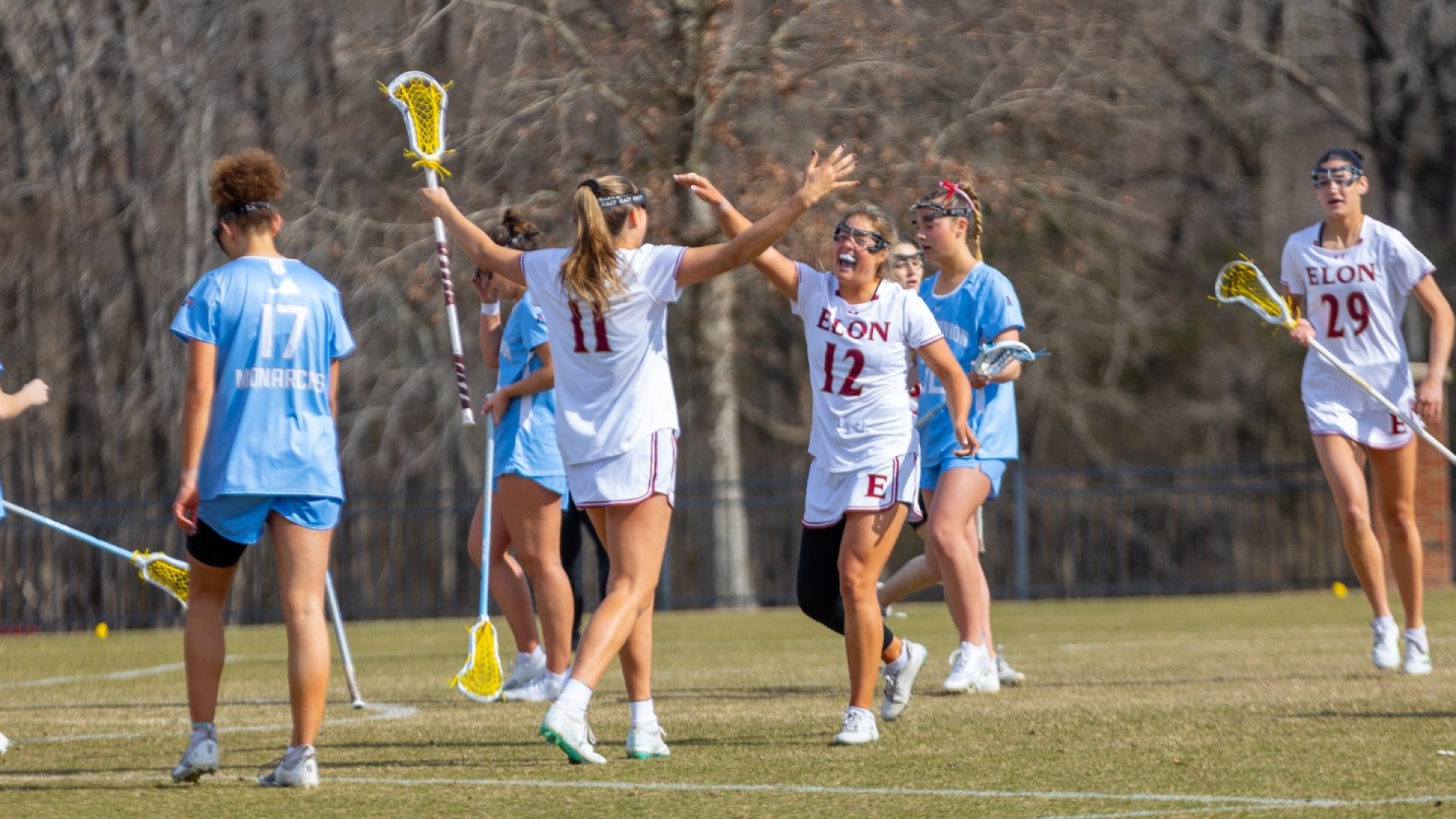 Anna Hackett and Ana Lee Vandiver celebrate Elon goal