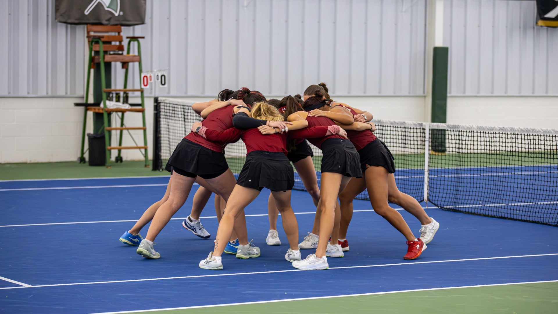 Women's Tennis huddle vs. George Washington 