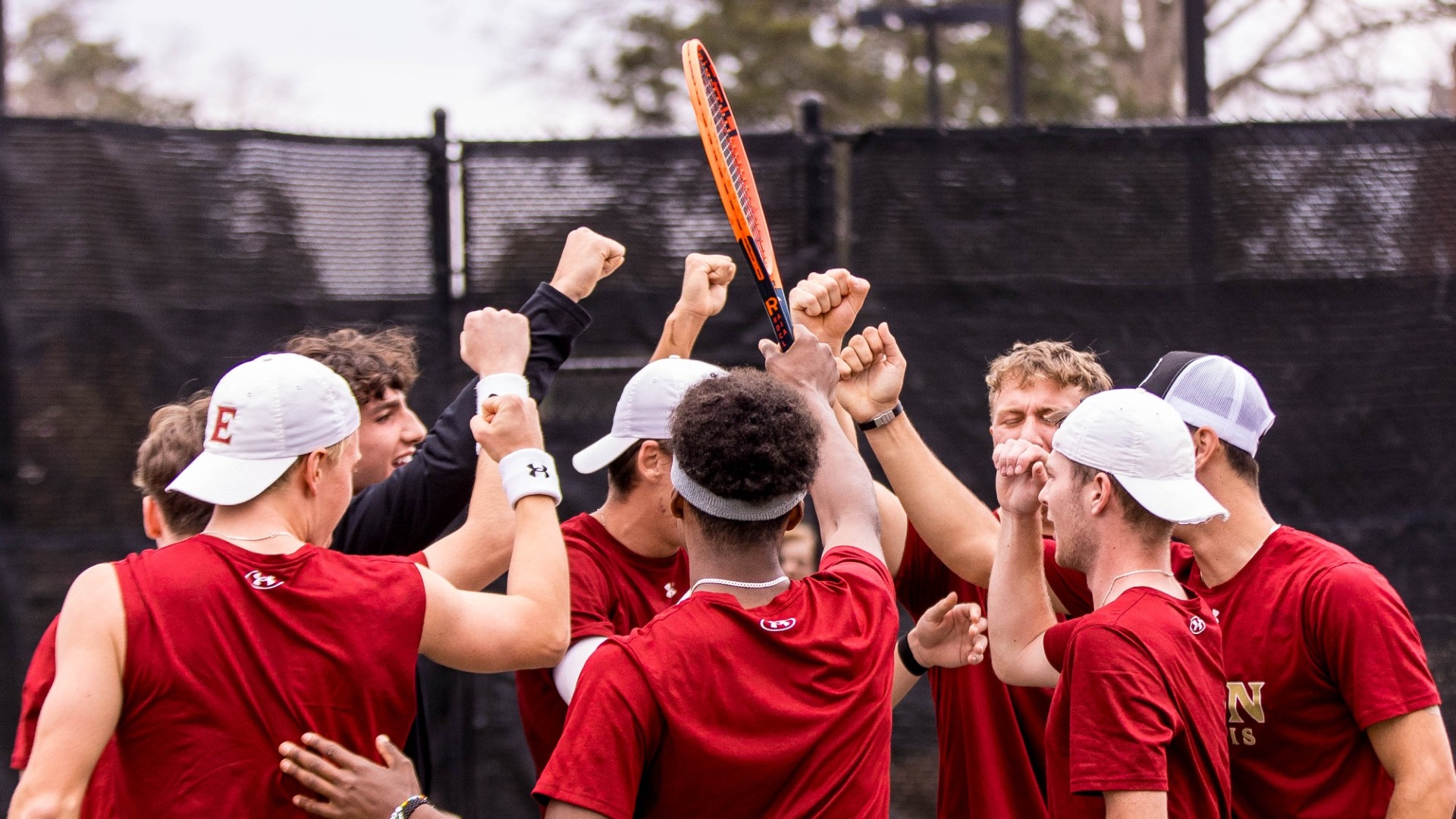Men's tennis huddle vs. Charlotte