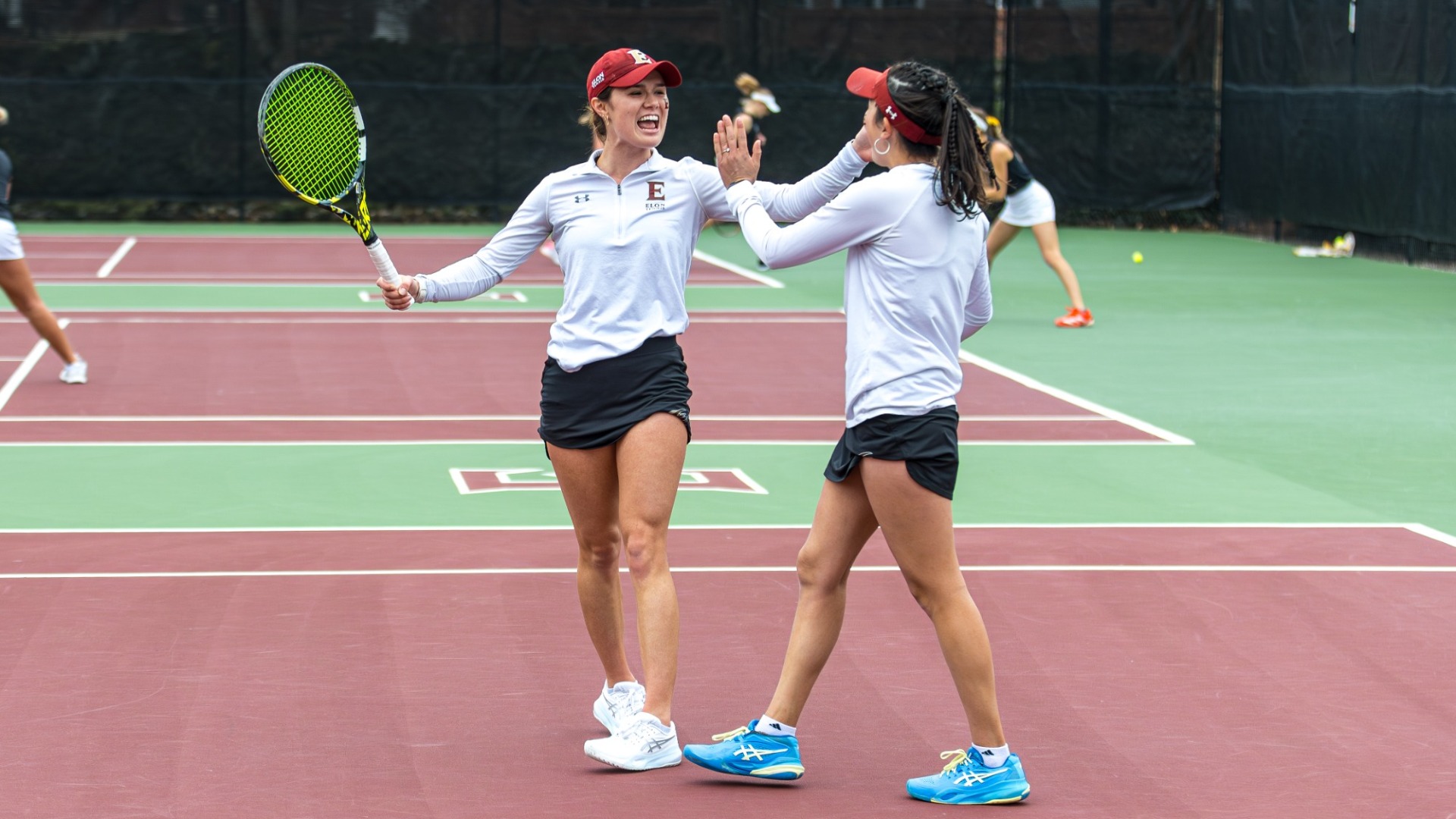 Simone Bergeron and Mariana Reding celebrate vs. Wofford