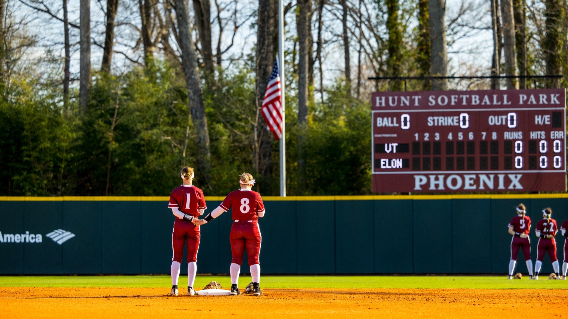 Elon softball standing during the National Anthem versus Virginia Tech on March 11