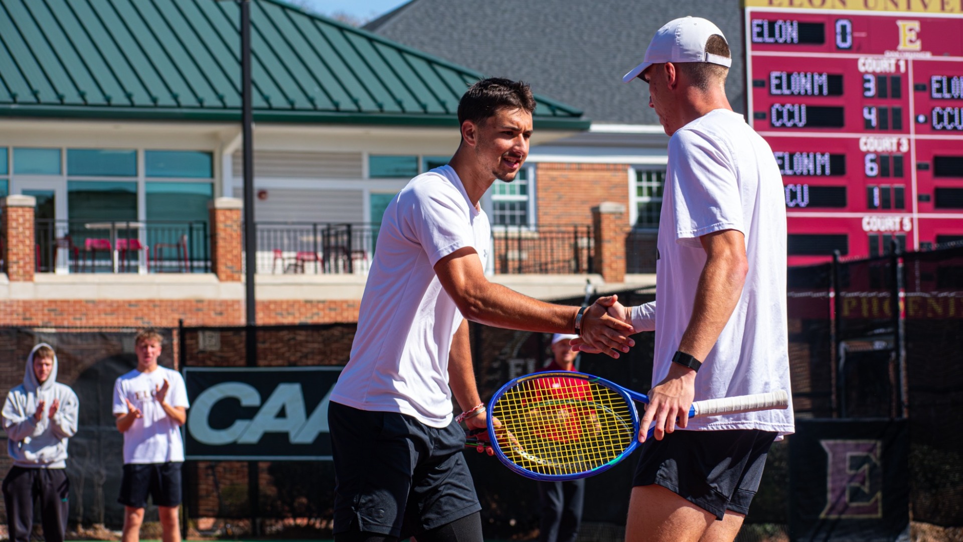 Nikola Parichkov and Veljko Krstic high five vs. Coastal Carolina
