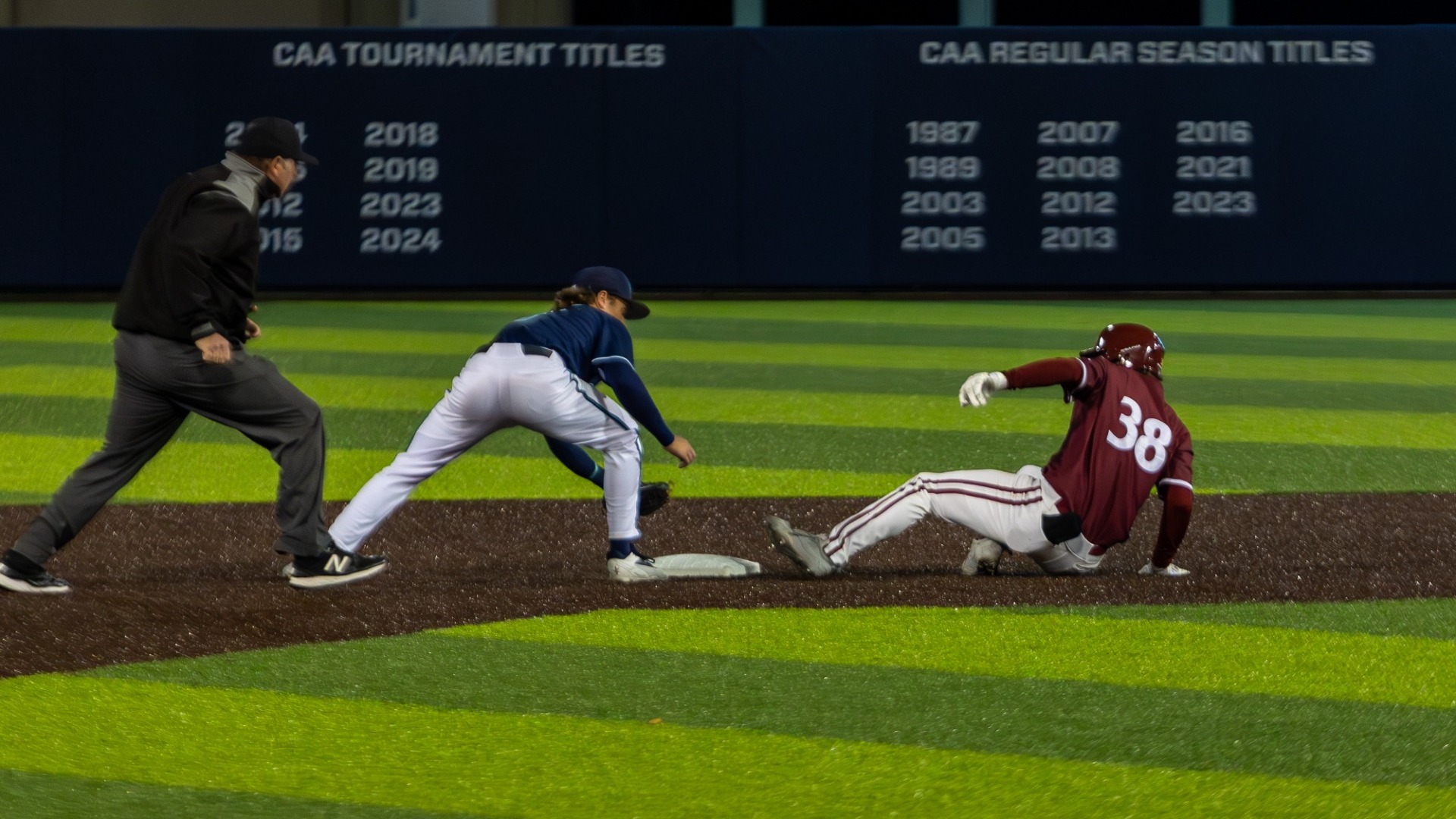 Henry Akopov slides into second base vs. Yale