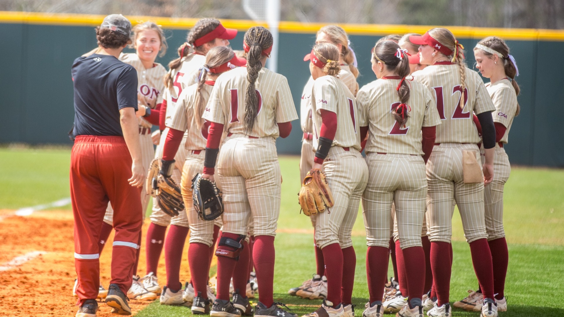 Elon Softball huddle versus Tarleton State on March 15