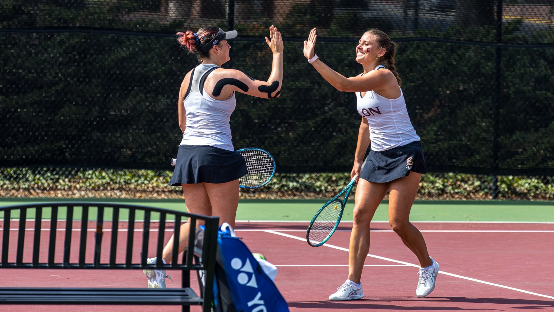 Lisa Kranec and Cornelia Kack doubles high five vs. South Alabama