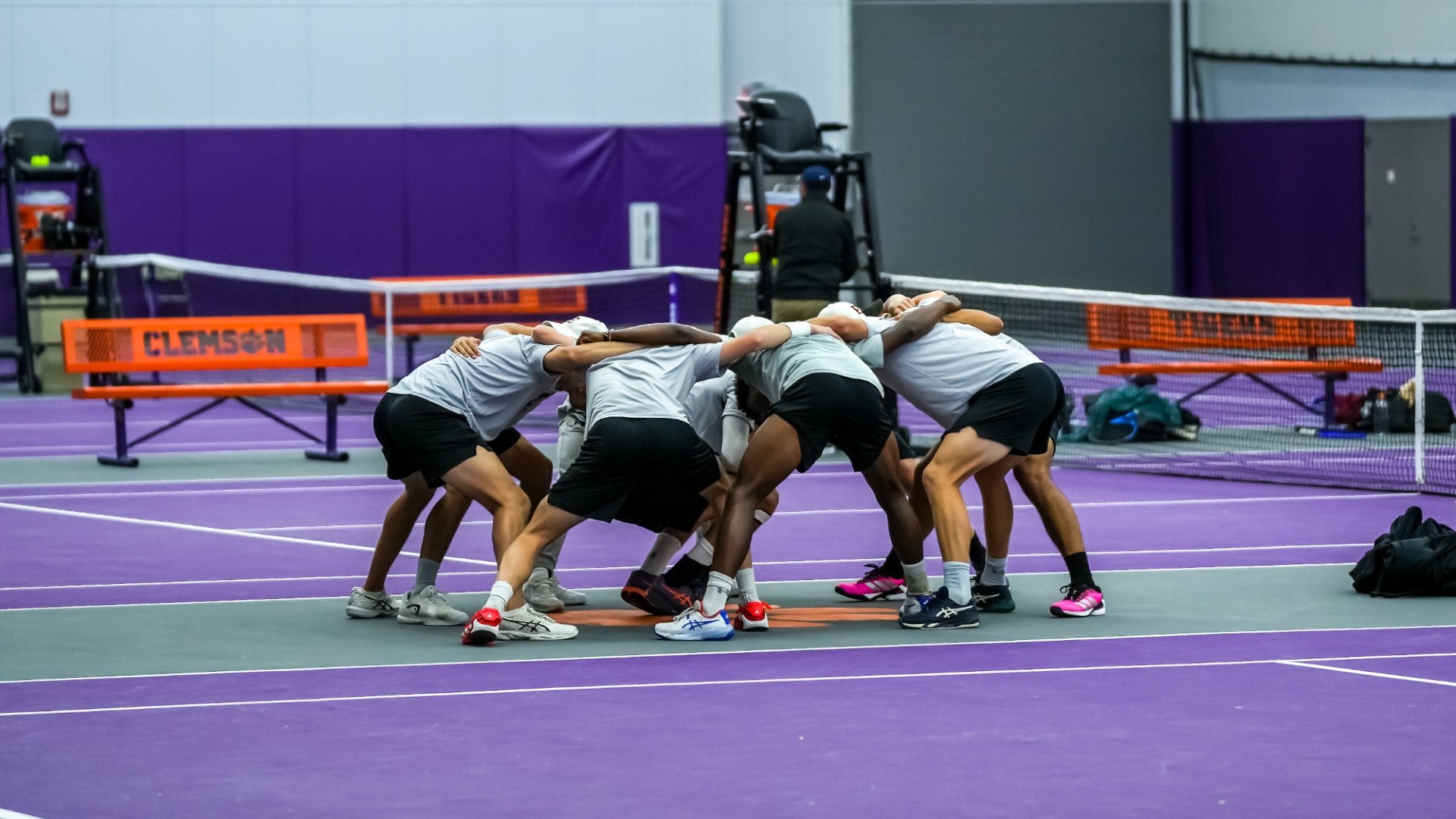 Men's tennis huddle at Clemson