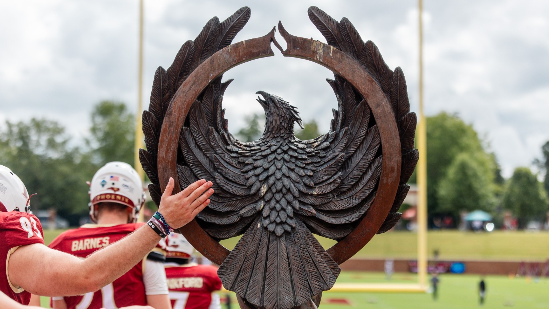Will McCoy with the Phoenix statue