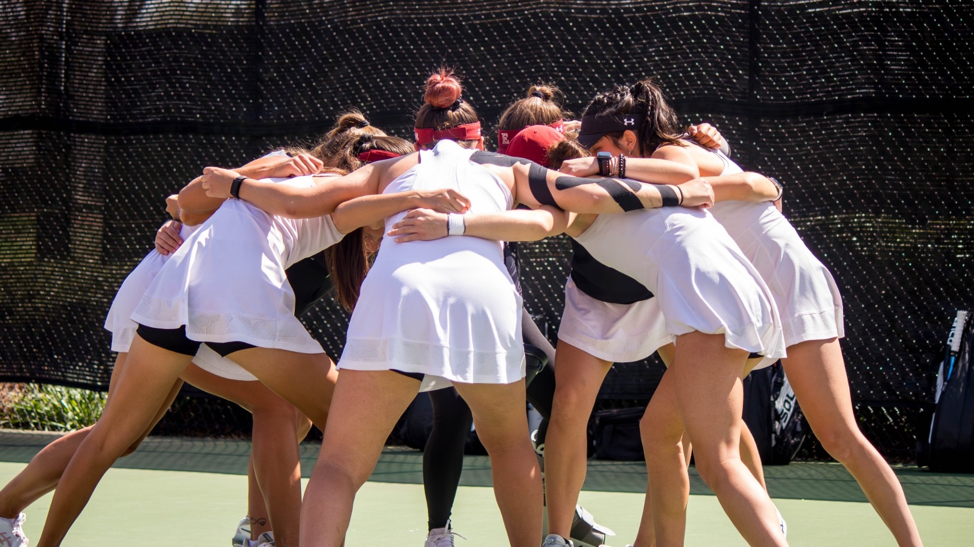 Women's Tennis huddle vs. UConn