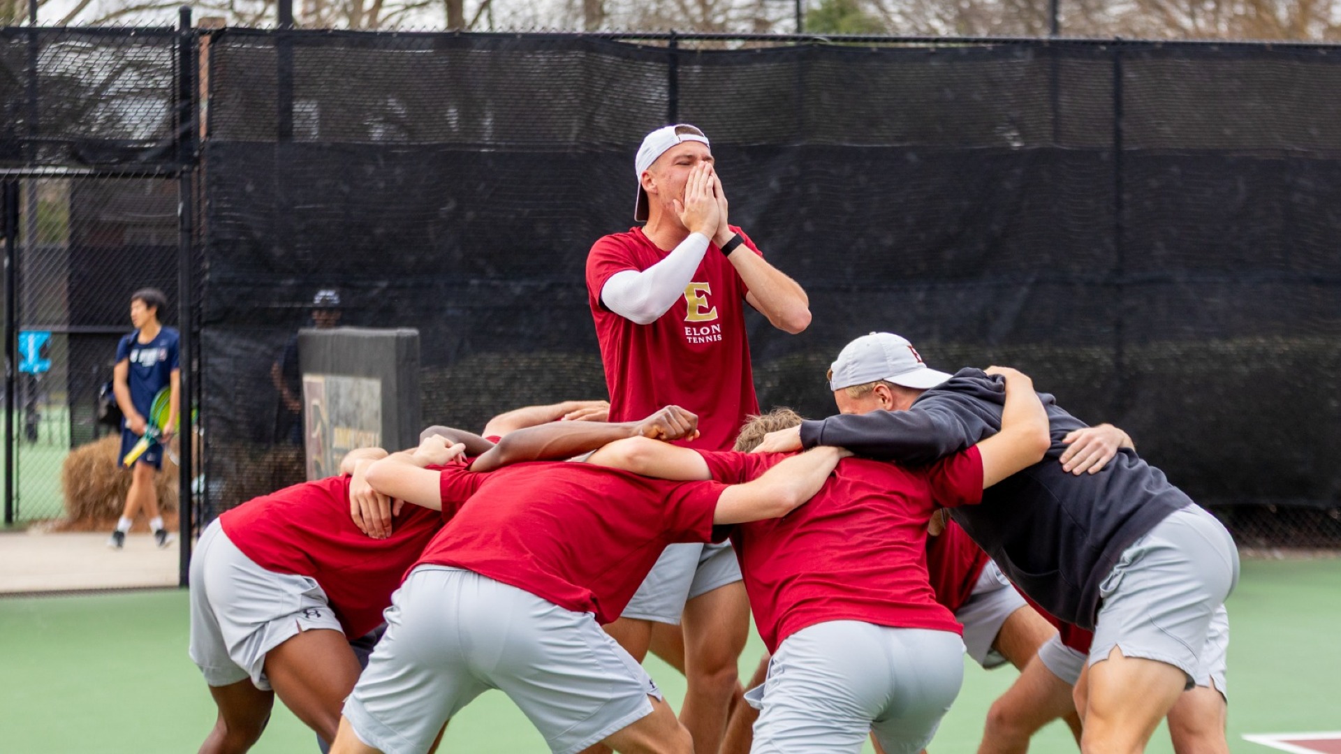 Men's tennis huddle vs. SC State