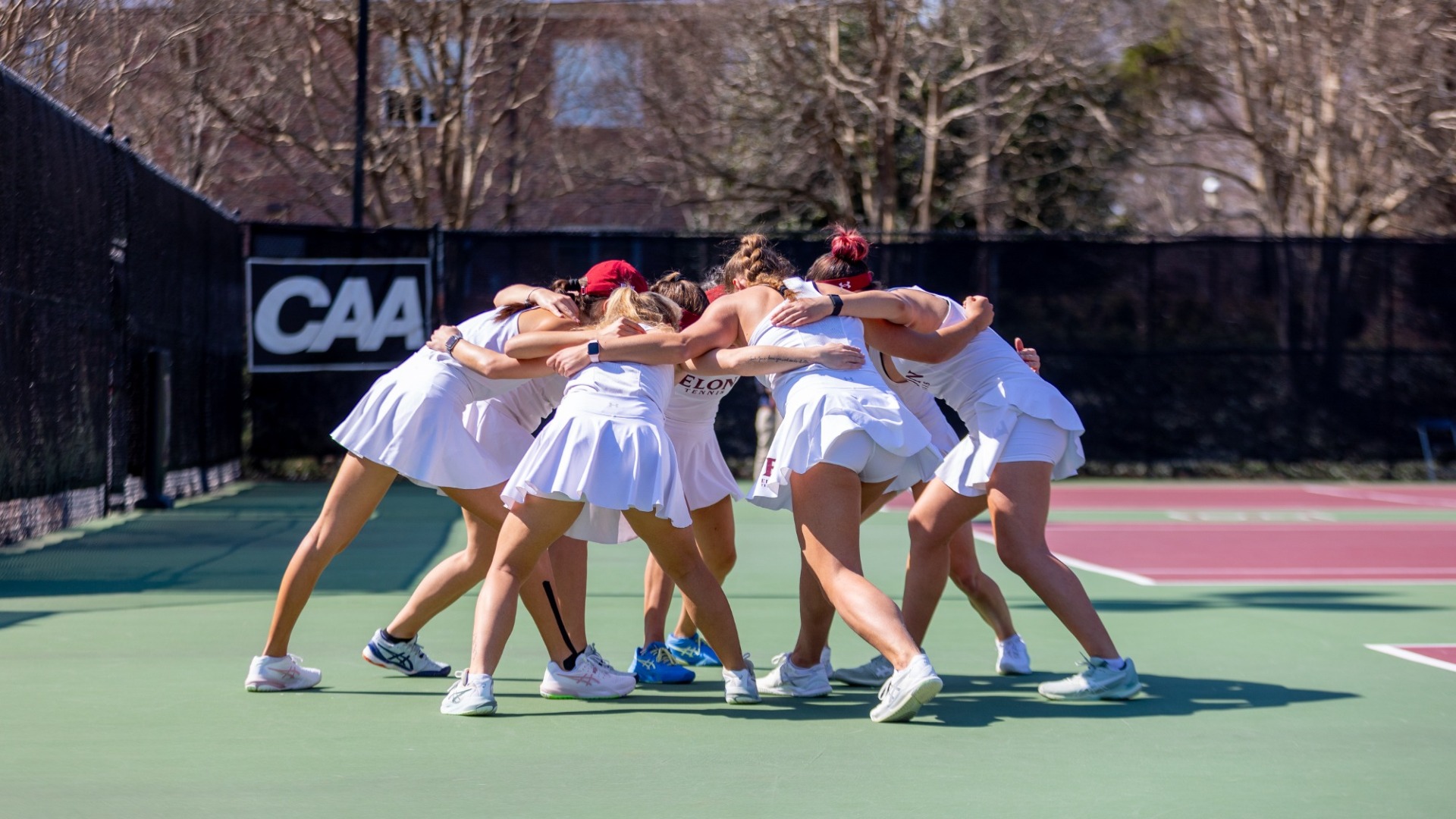 Women's Tennis huddle vs. Davidson
