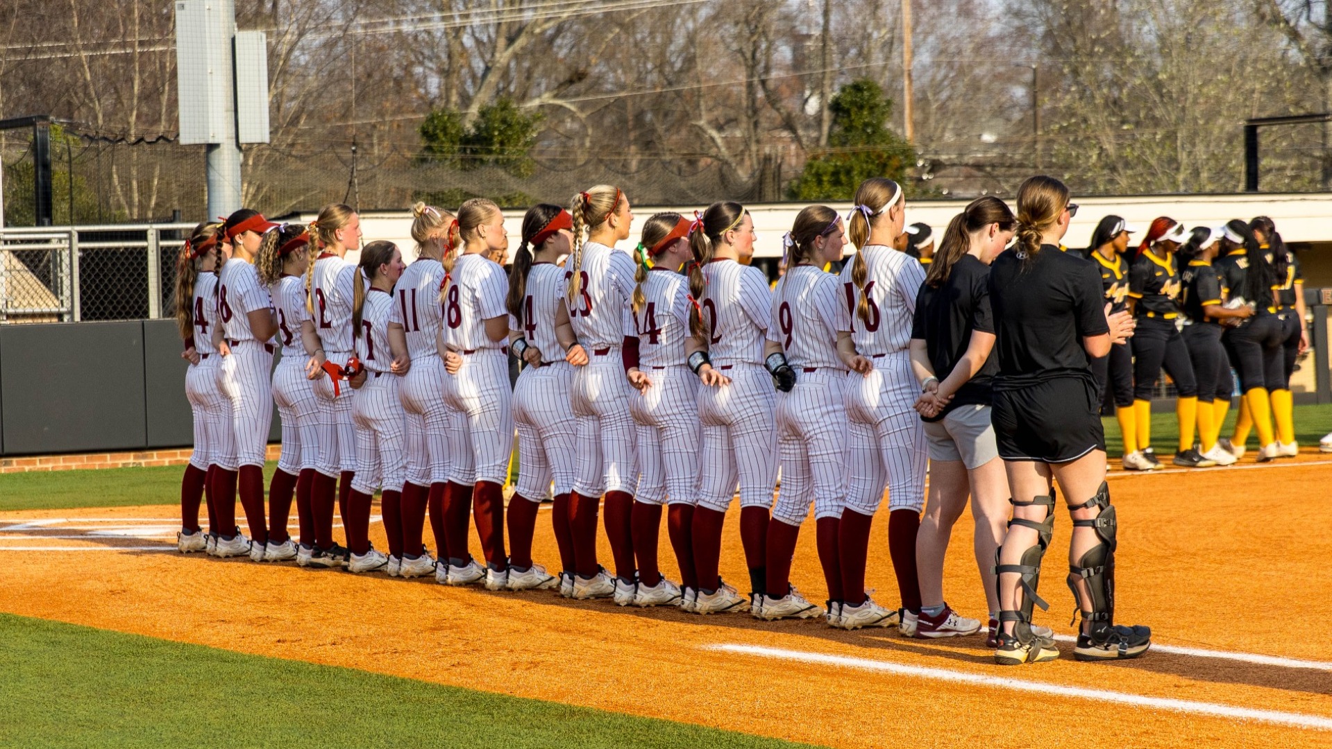 Elon softball standing during the National Anthem versus N.C. A&T on March 6