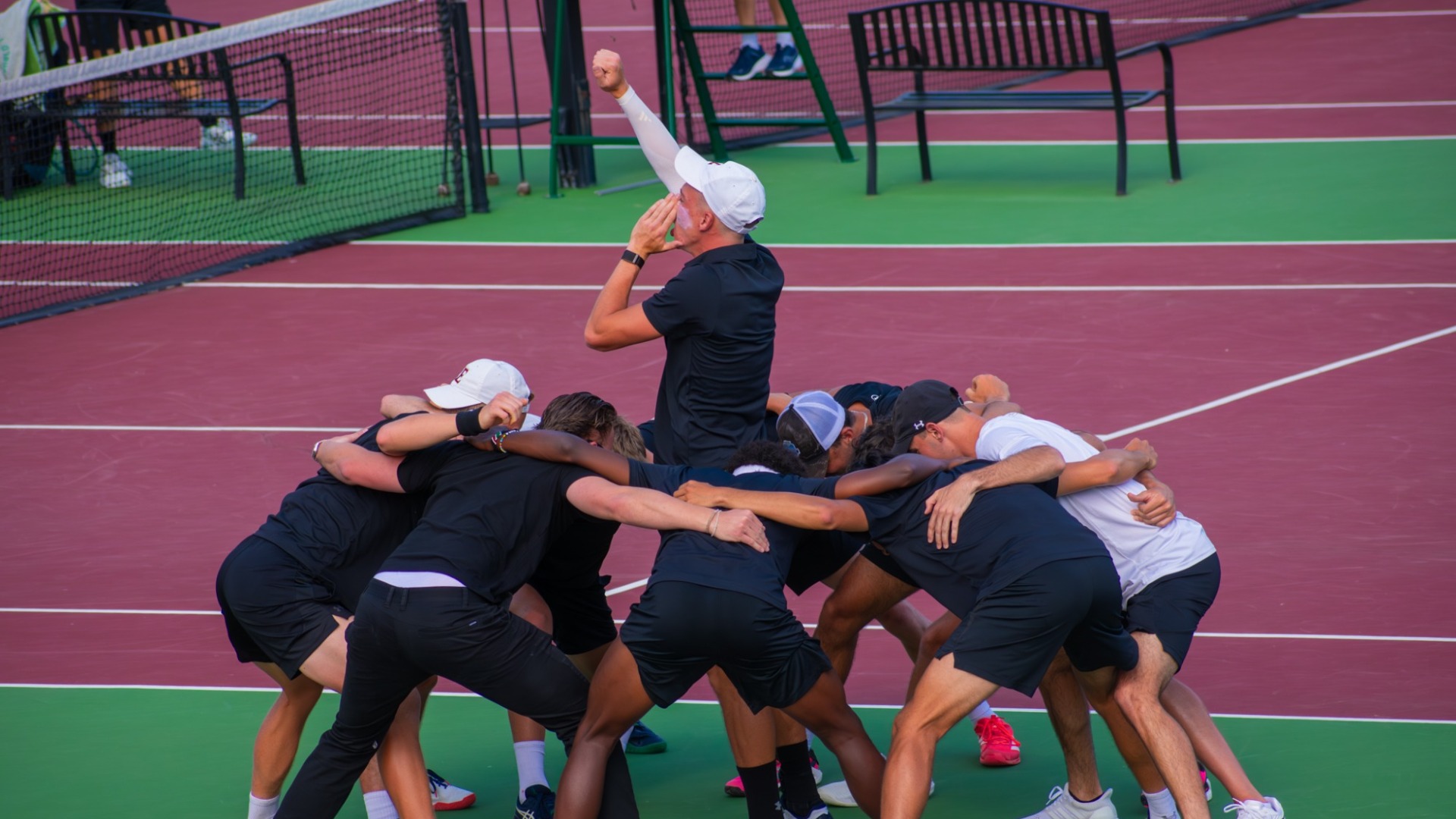Men's tennis pre-match huddle vs. Campbell