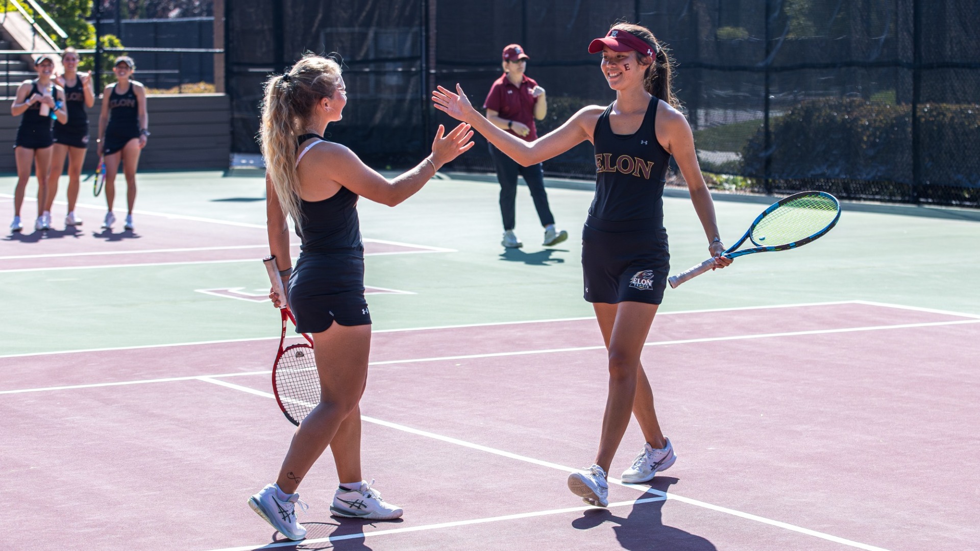 Madison Cordisco and Alexis Nyborg high five