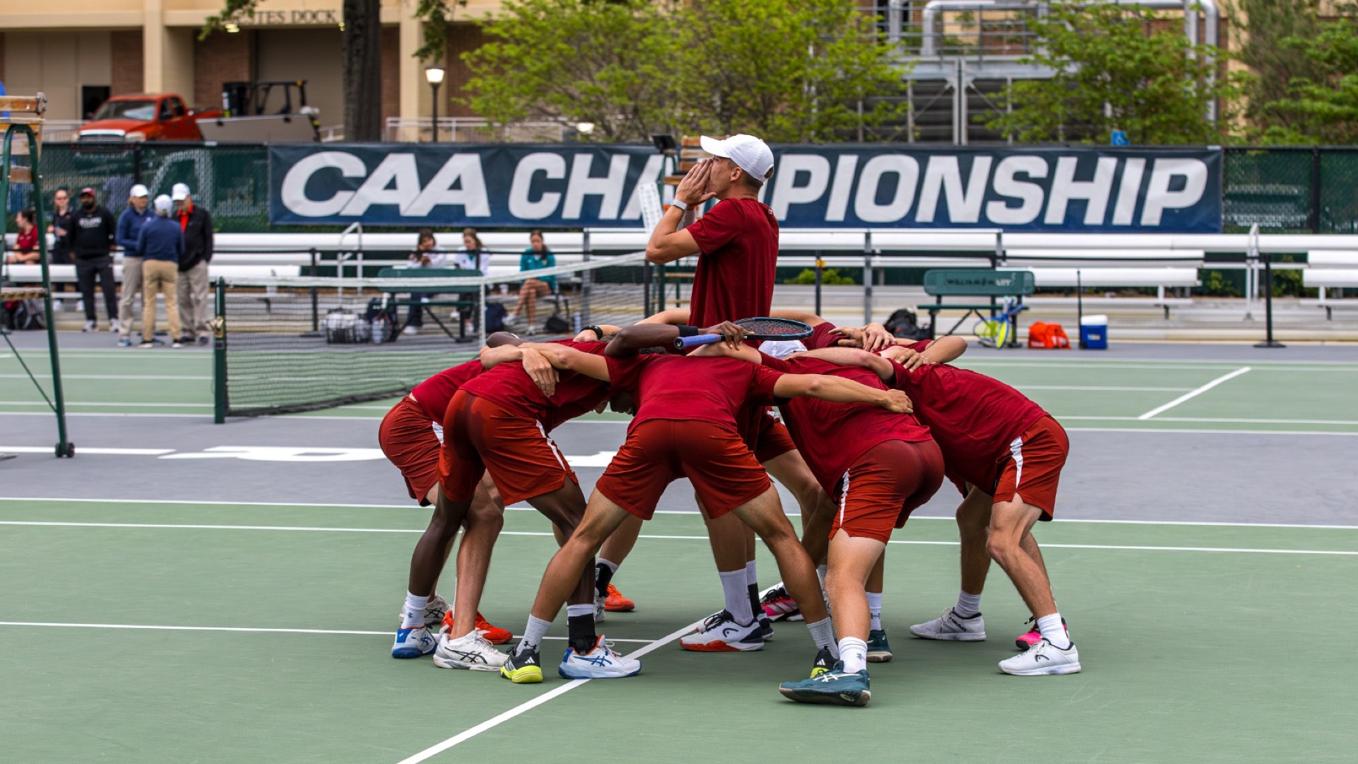 Men's Tennis CAA championship match huddle
