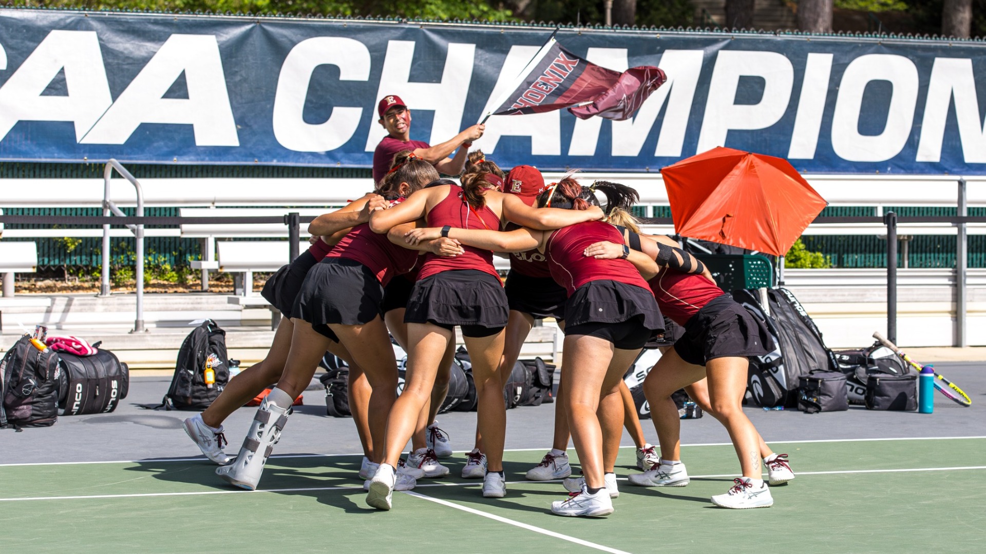 Women's Tennis CAA Semifinal huddle