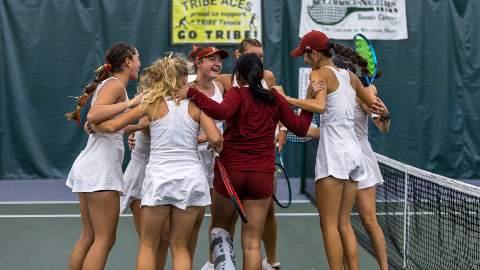 Women's Tennis doubles celebration vs. William & Mary