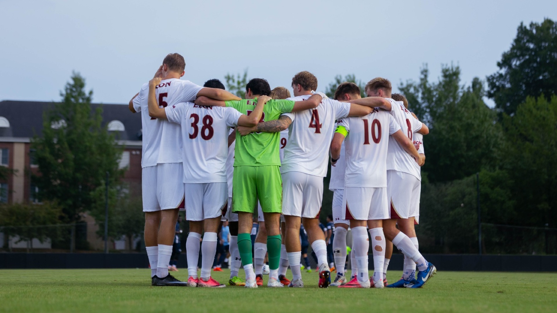 Men's Soccer huddle vs. Liberty