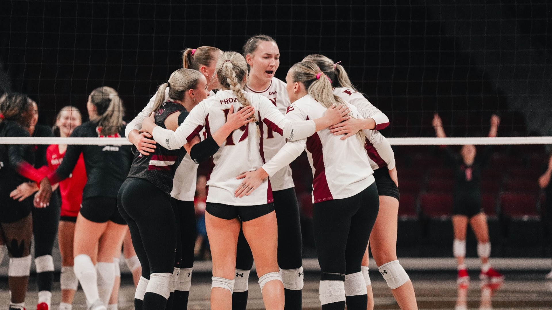 Elon Volleyball huddle versus Davidson on Sept. 11