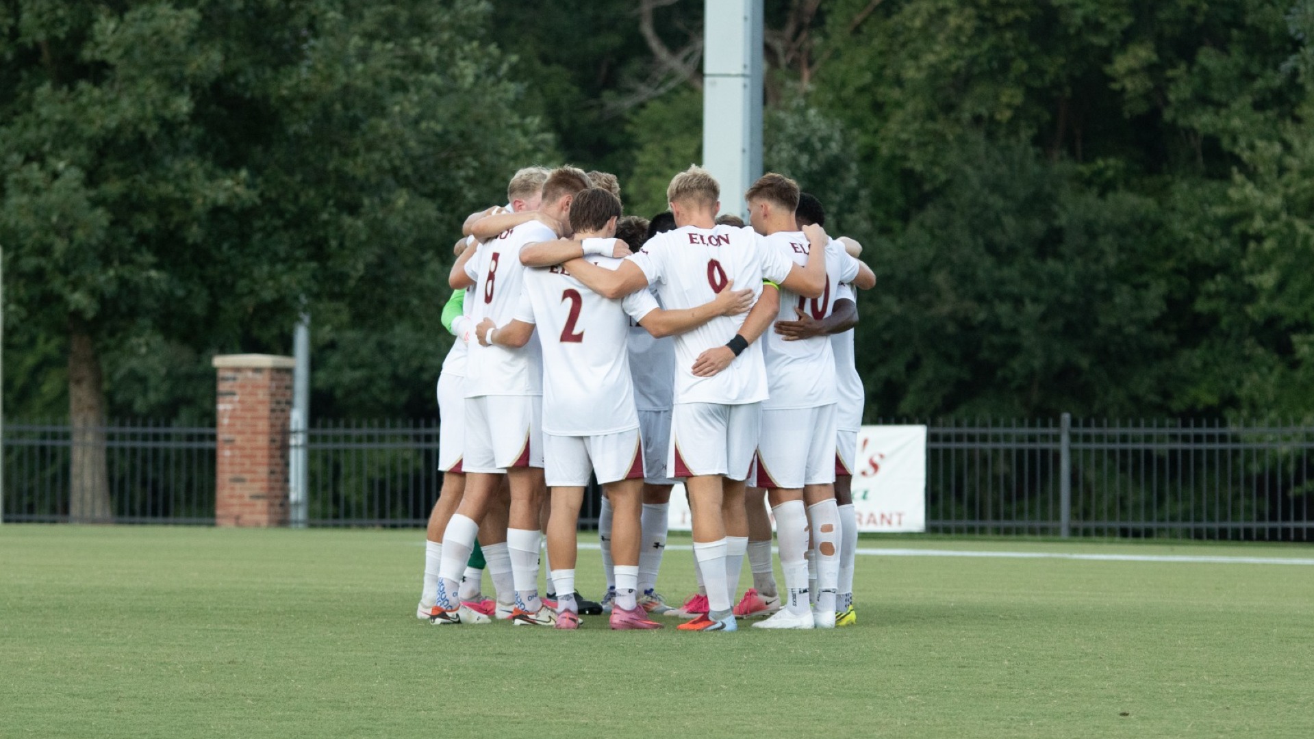 Men's Soccer team huddle vs. VMI