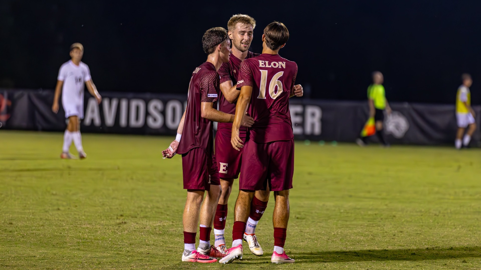 Daire McCarthy and Diego Thompson celebrate at Davidson