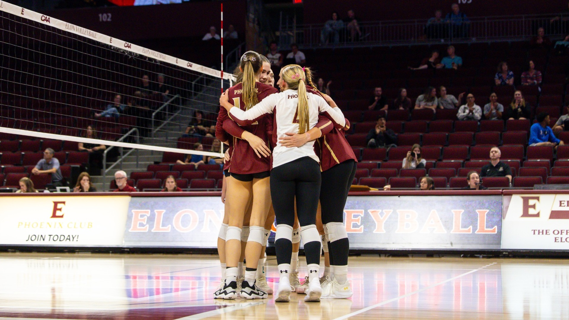 Elon volleyball huddle versus App State on Sept. 8