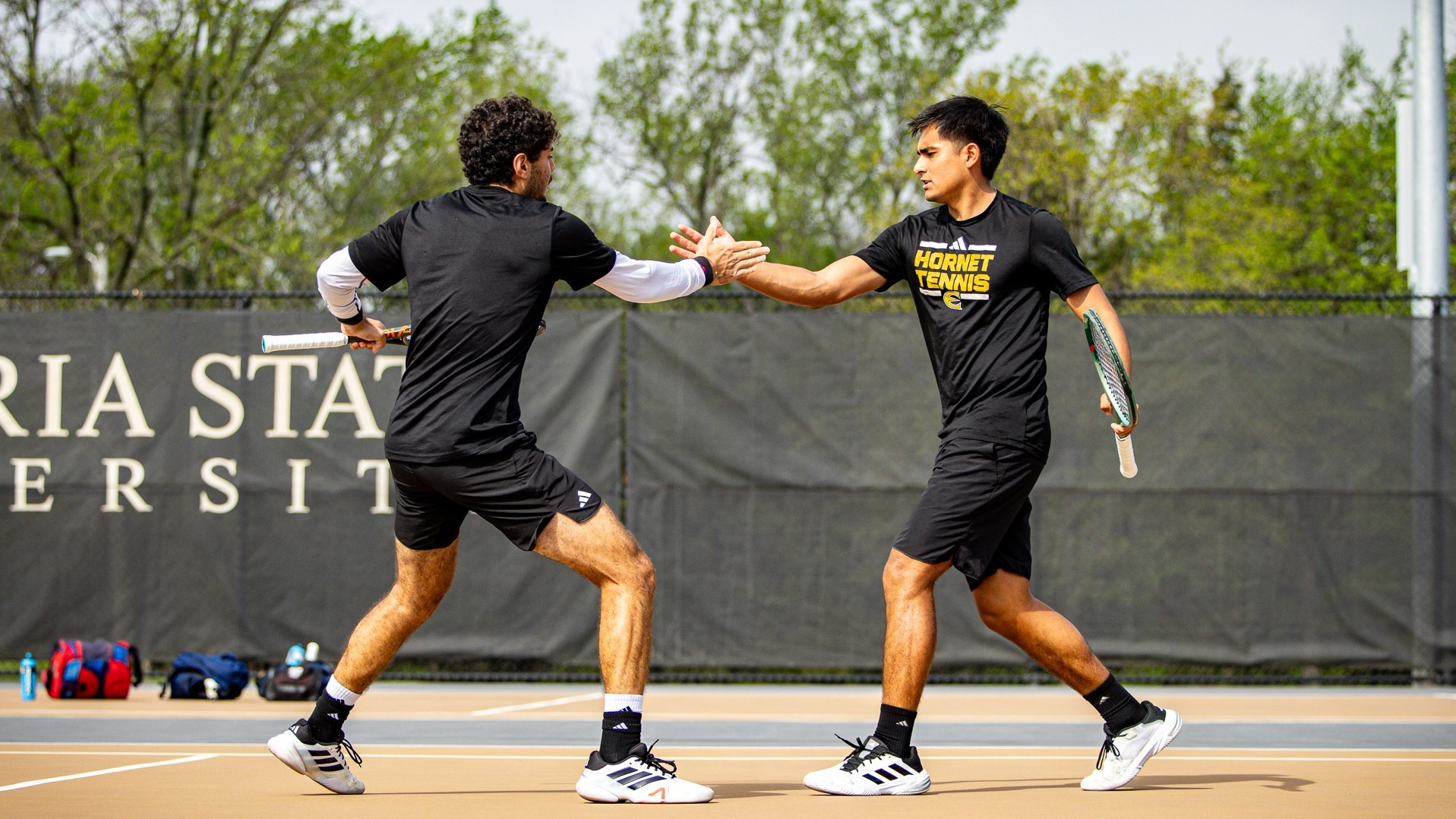 2026 Emporia State Men's Tennis handshake between Elbasnaly and Torres