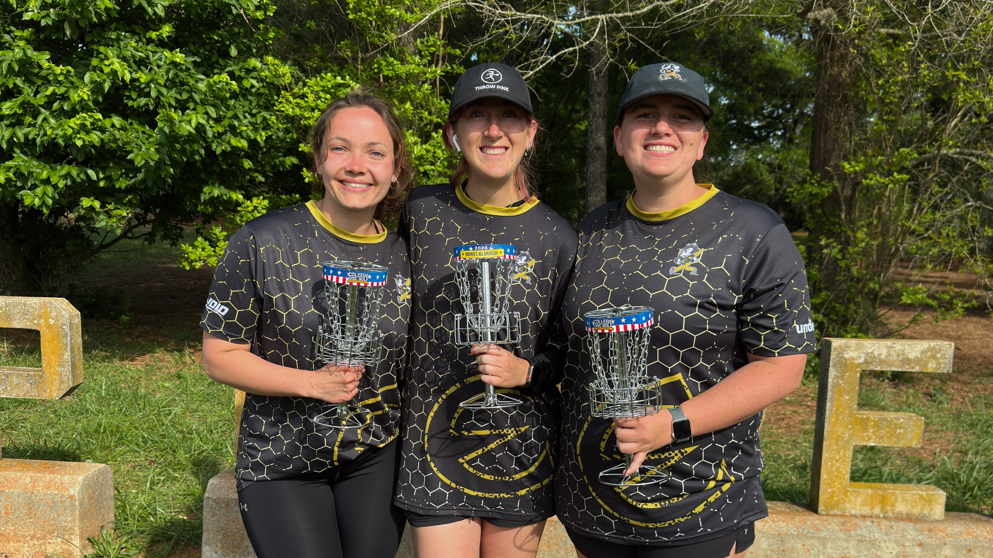 Atlanta Krueger, Madeline Joiner and Isabella Parker at Disc Golf Nationals with trophies