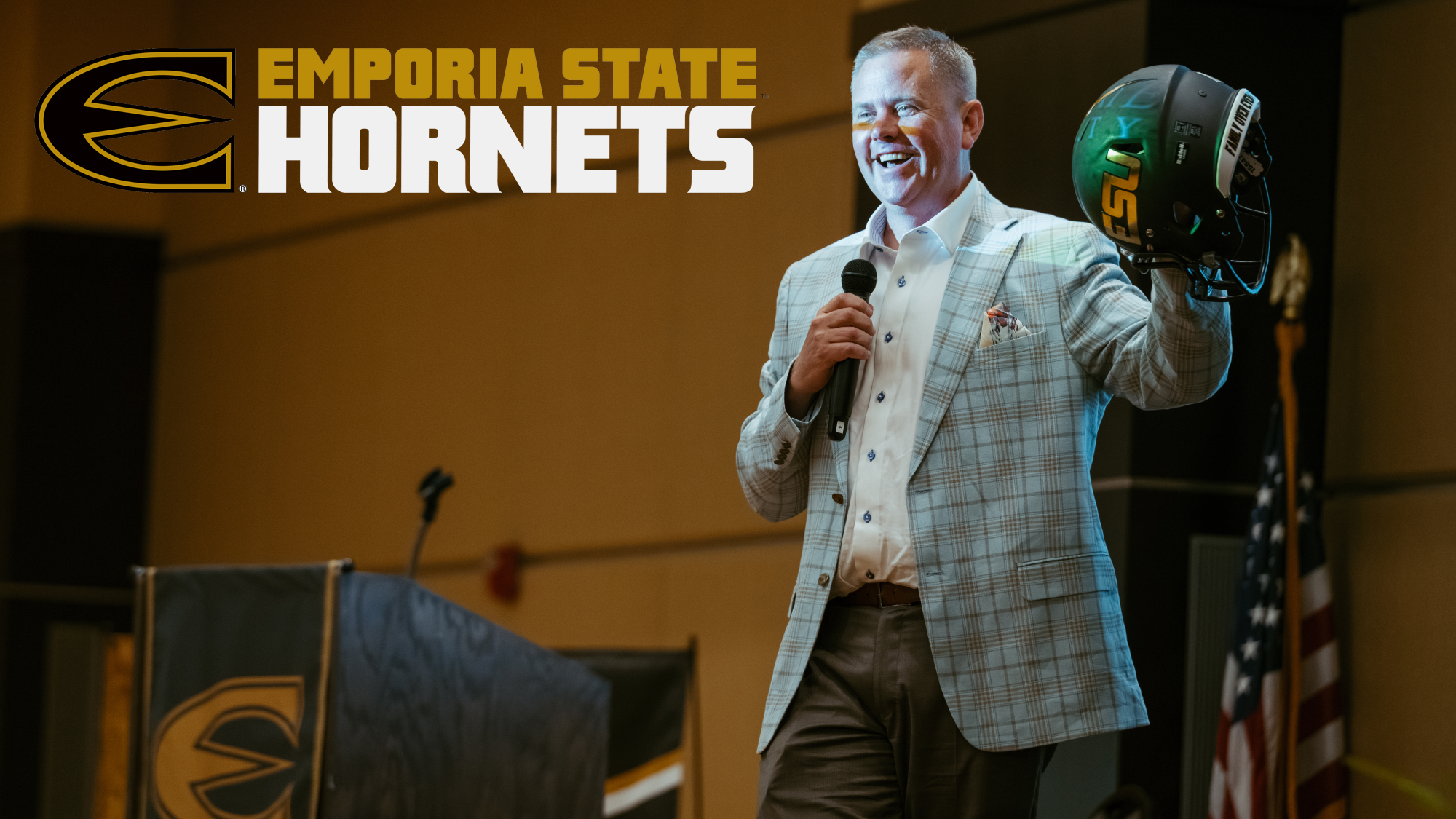 Emporia State AD Steve Rodecap with football helmet for free tickets