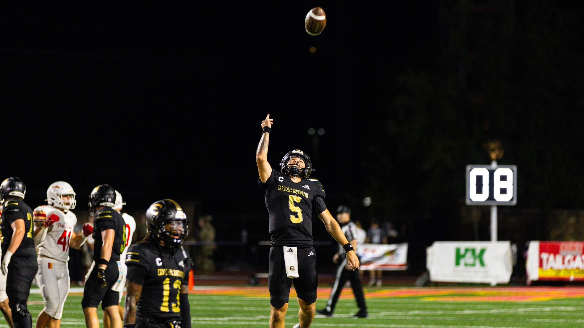 2026 ESU Football Ben Harris tossing football in the air in celebration at PSU