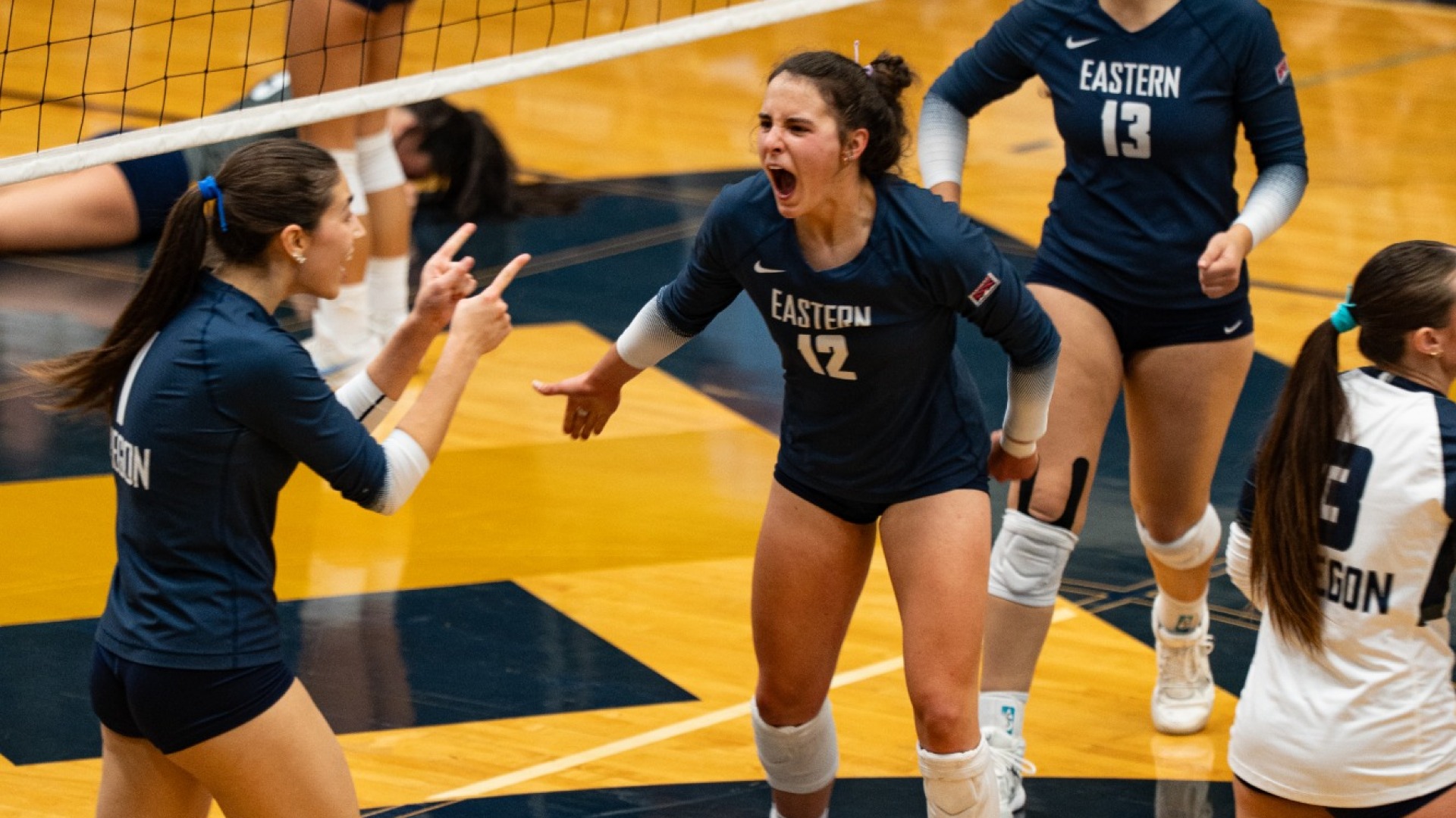 Mylie Mills & Brooke Womack cheer after winning point