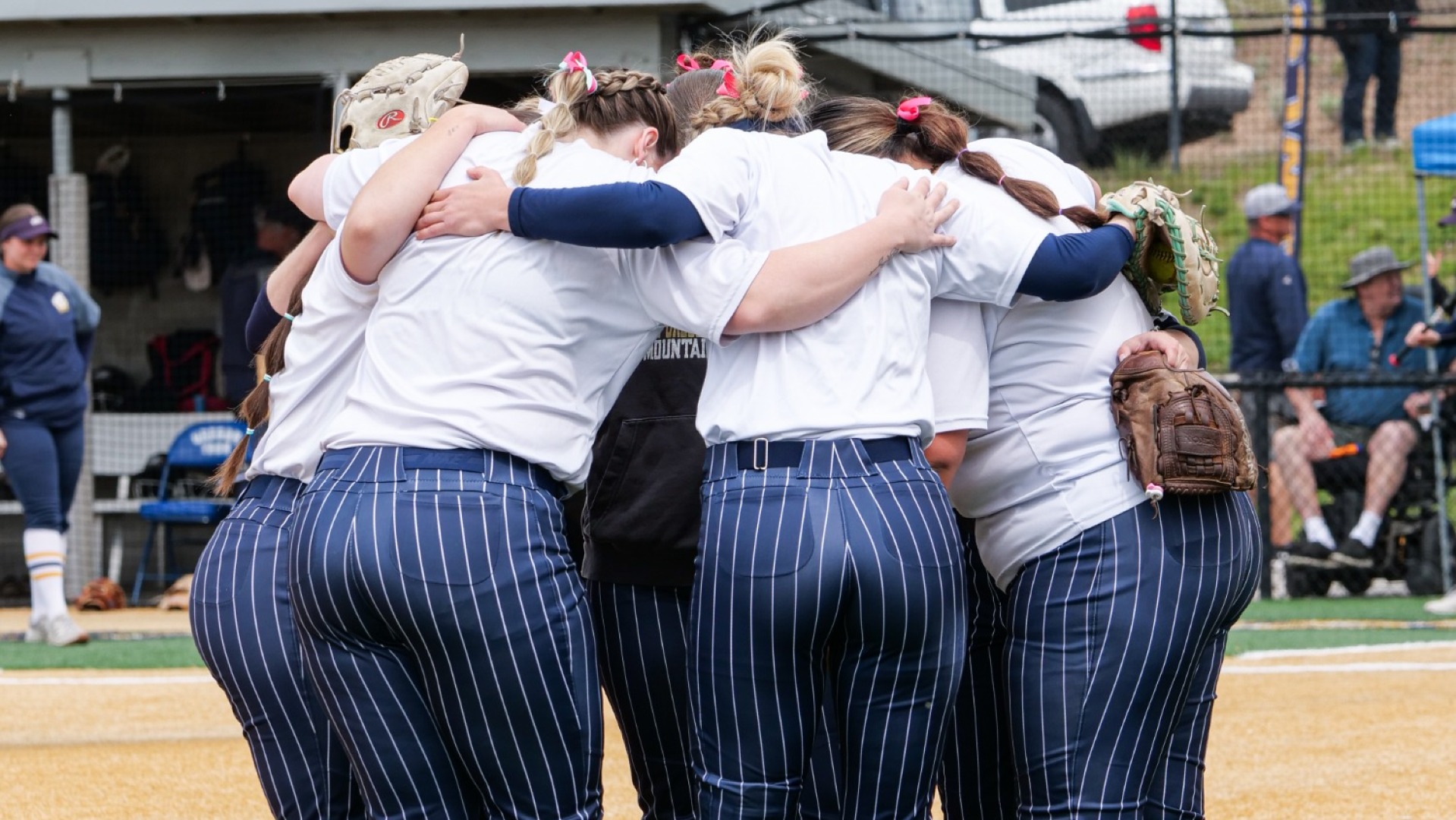 Softball seniors huddle