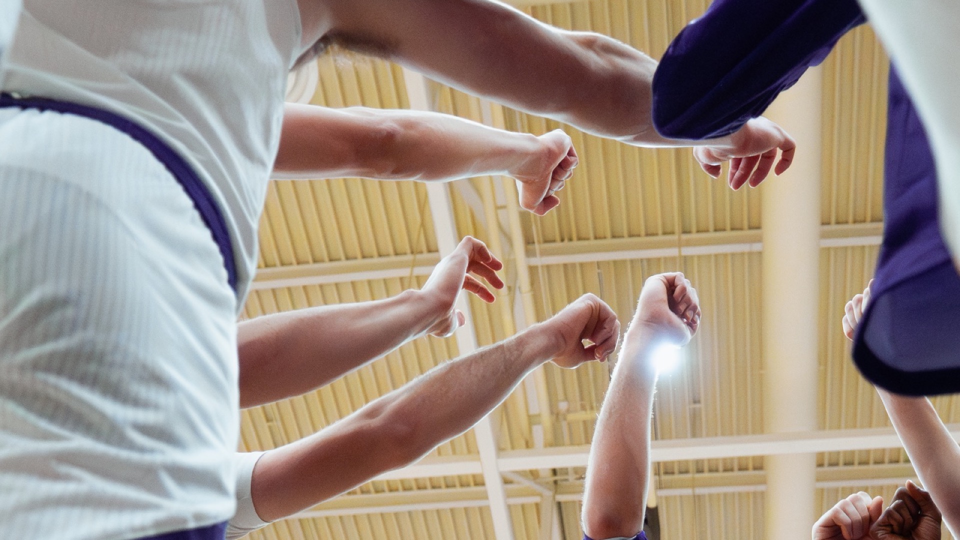 Men's basketball team huddle