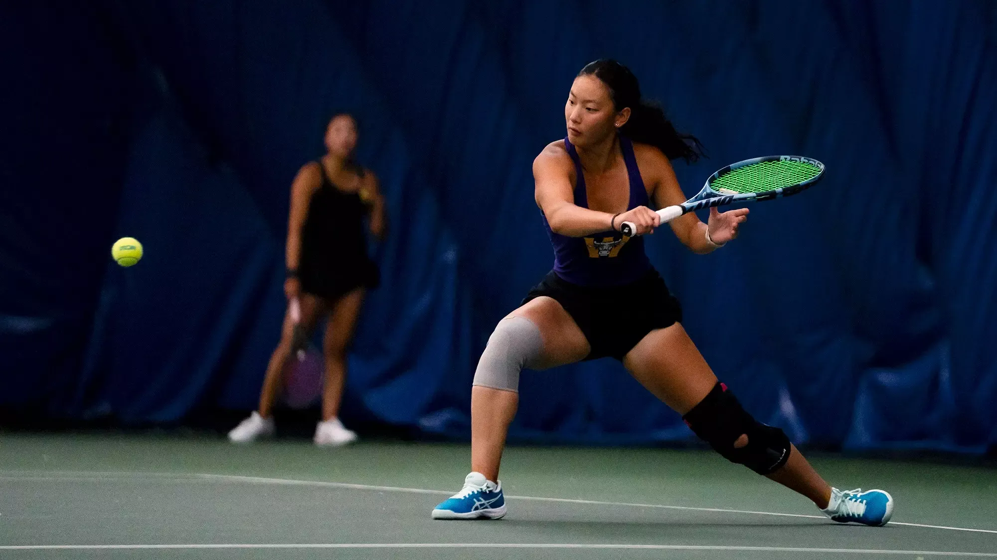 Julia Zhang returns a shot against Bowdoin at the NCAA Tournament, May 9, 2026
