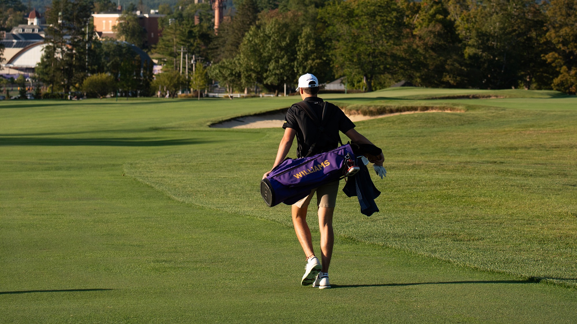 Men's golfer walking the course