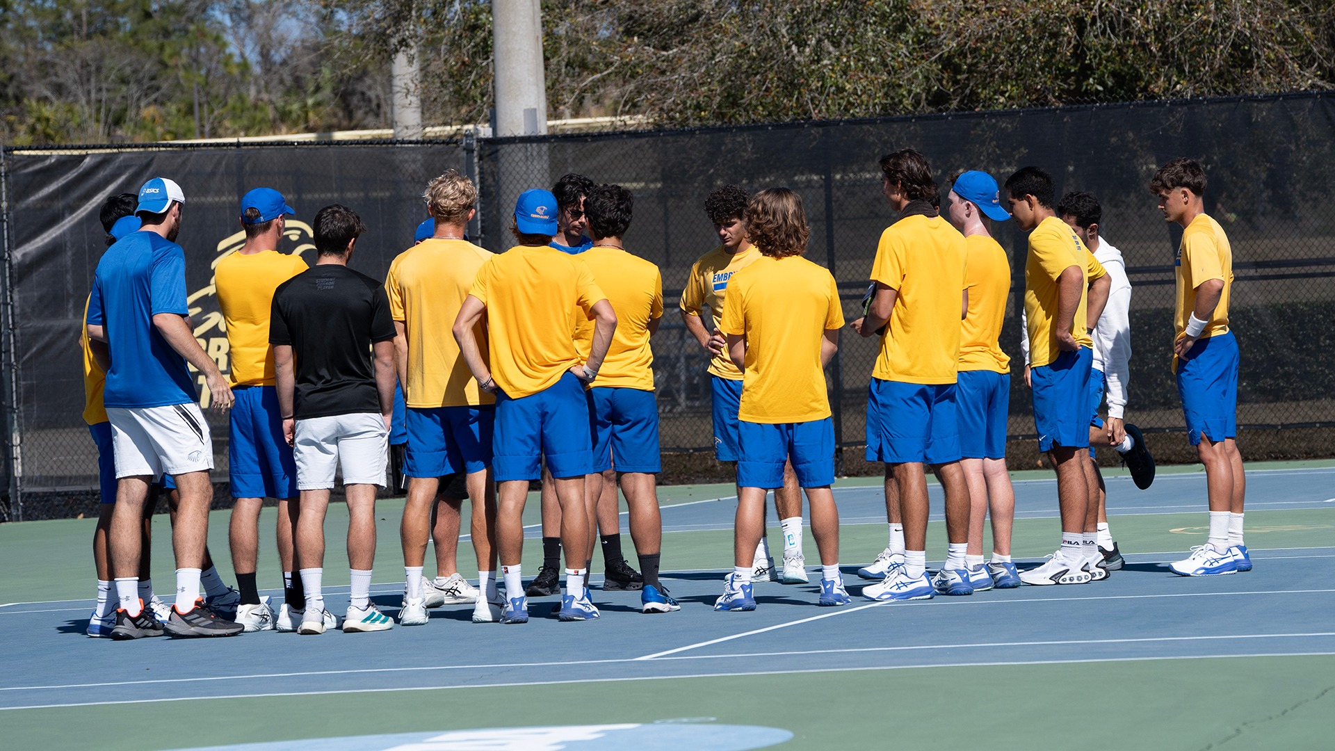 men's tennis team huddle vs washburn
