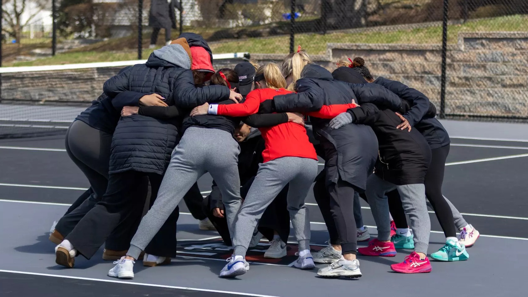 Women's Tennis huddle