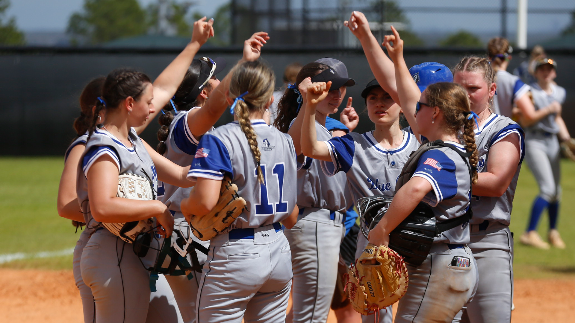 Softball team huddle vs Chatham 030526