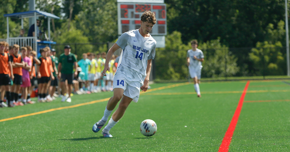 Elizabethtown College men's soccer freshman Chase Ballinger dribbles the ball against Marywood on September 6, 2026