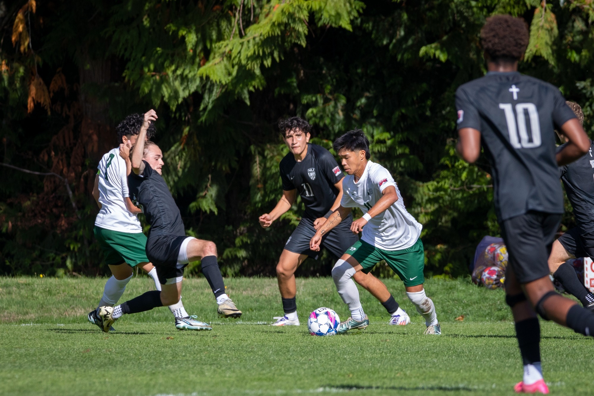 Kainoa Wong controls the ball for Evergreen.