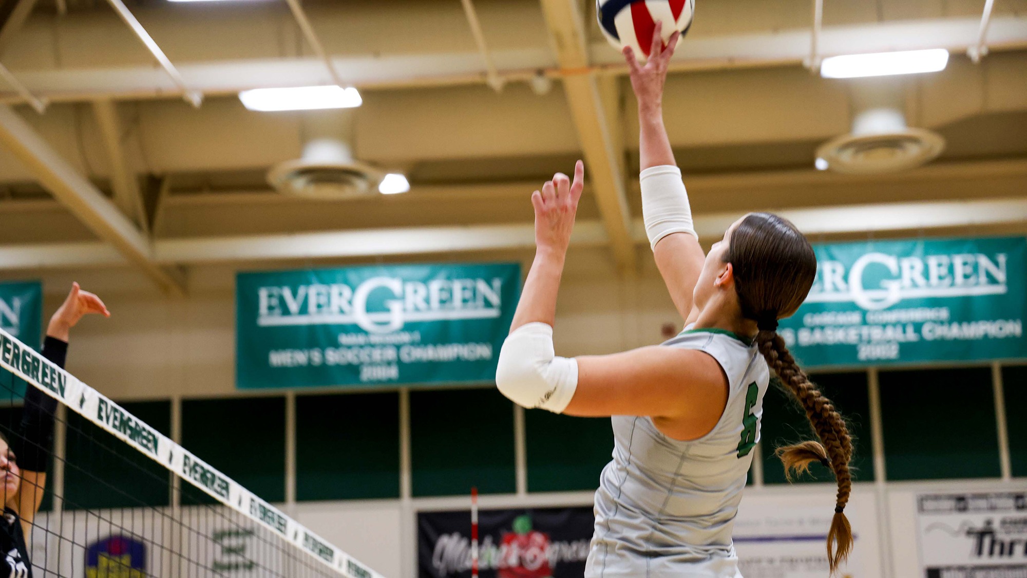 Sophia Scroggins registers a hit for the Evergreen volleyball team.