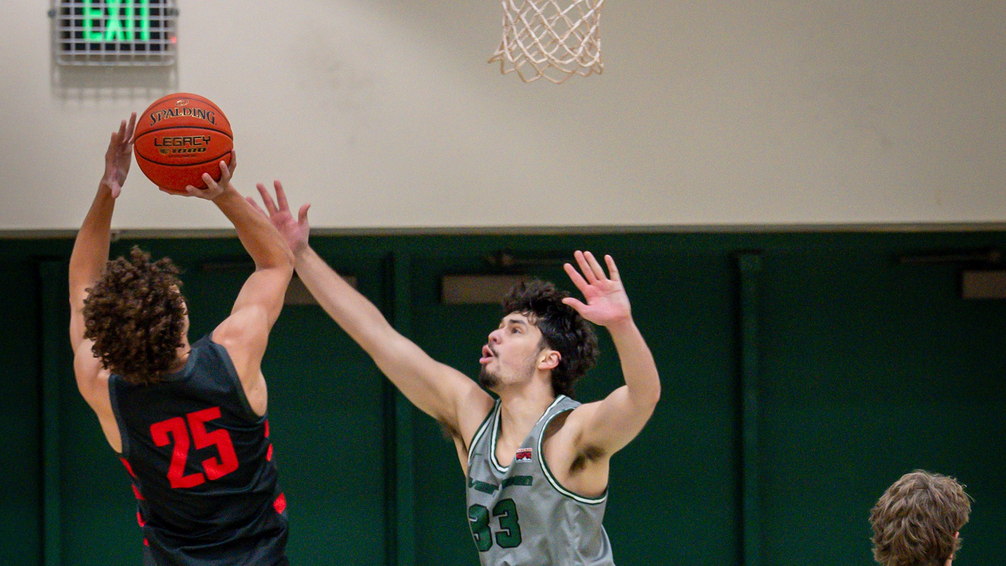 Jacob Laff reaches out to impact a shot by an opponent.