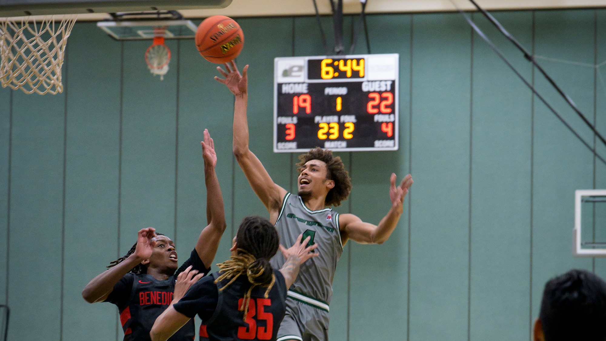 Tony Frohlich-Fair shoots a layup for Evergreen.