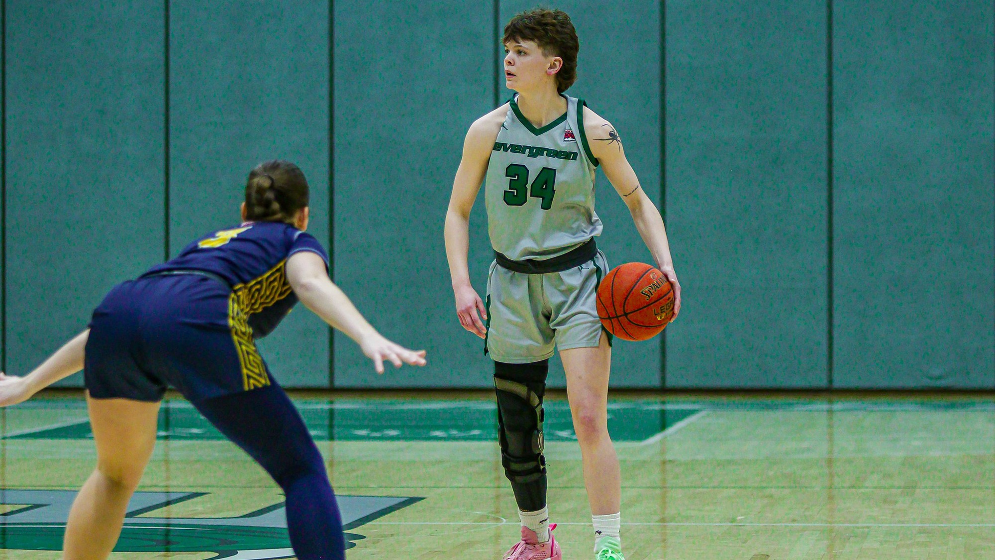 Jenna Glenzel looks for options to pass the basketball.