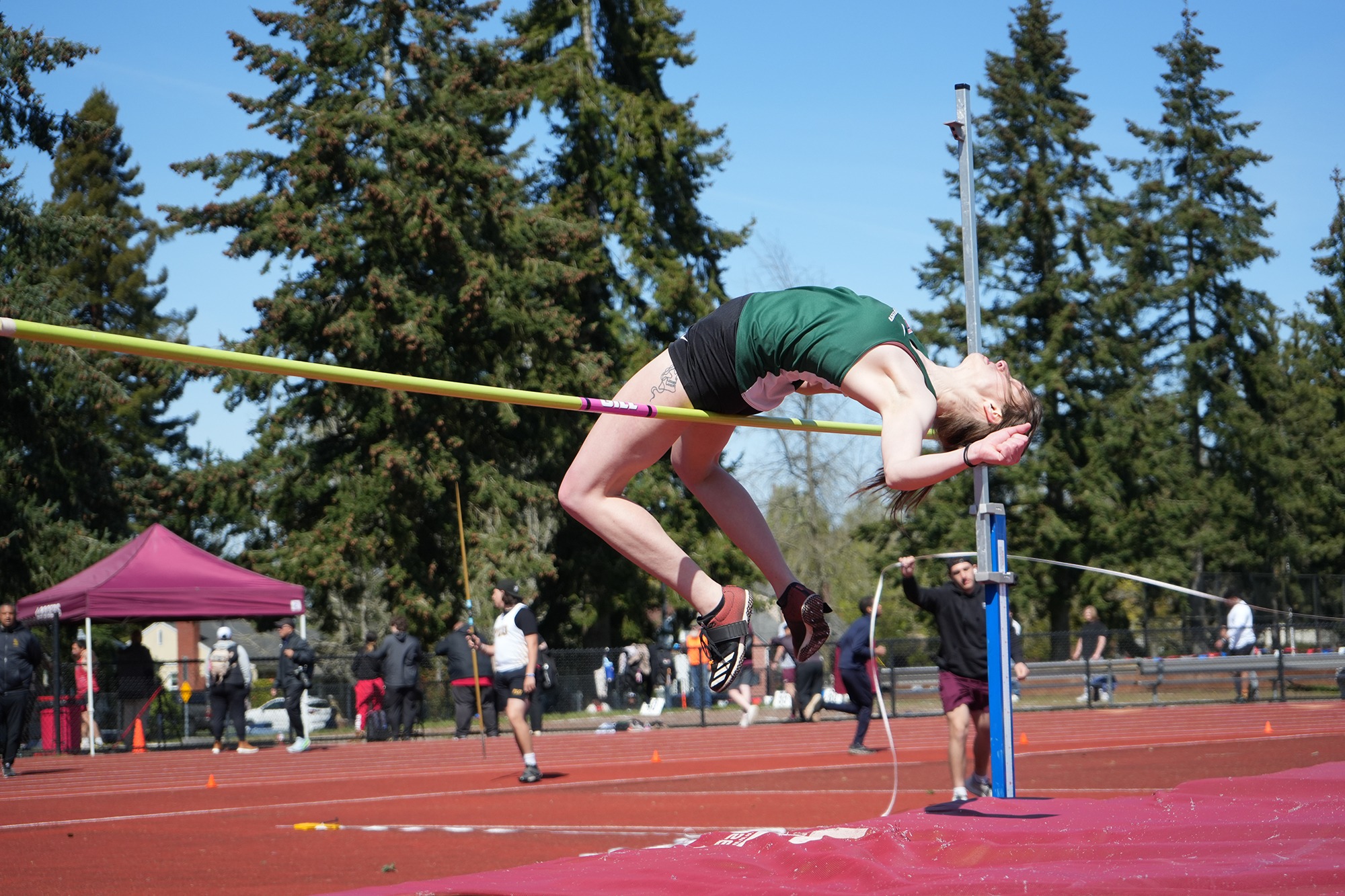 Corona Parker competes in the high jump for Evergreen.