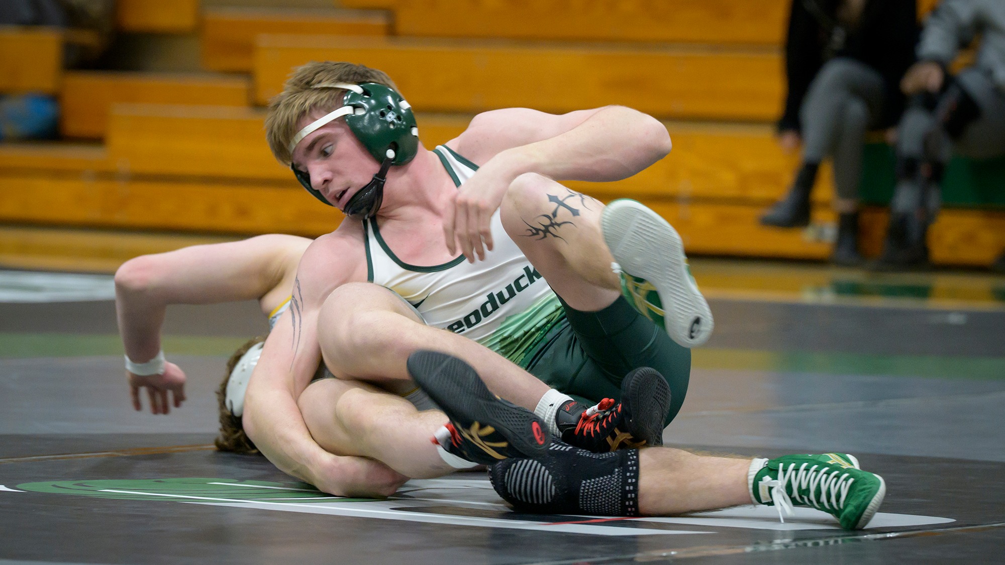 Alex Fenwick wrestles for the Geoducks.
