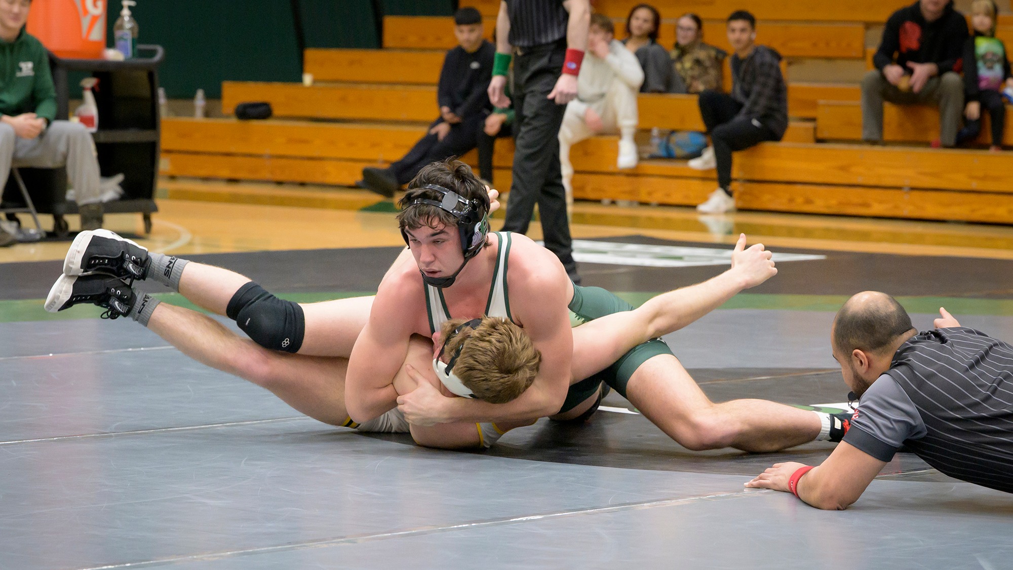 Cole Torres is in control during a wrestling match for Evergreen.