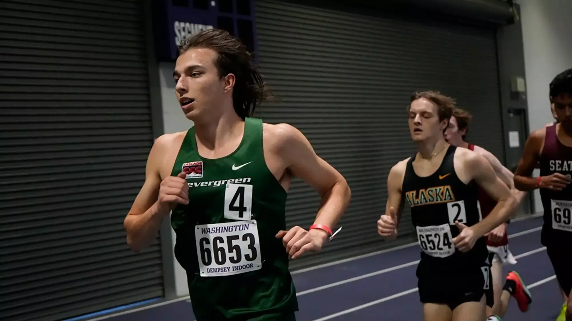 Max Baeder runs indoors at the UW Preview in 2026.