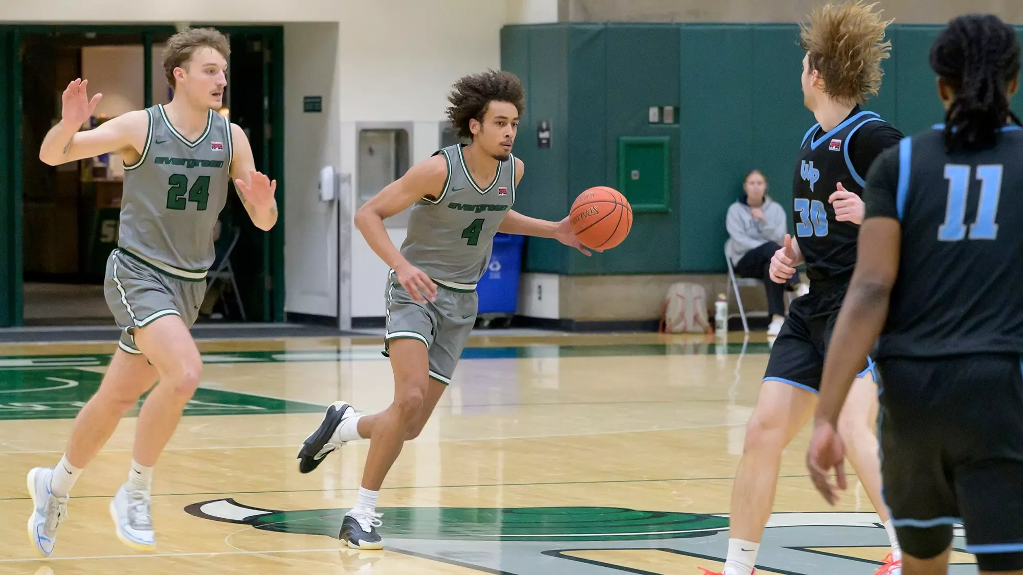Tony Frohlich-Fair drives down the court for the Geoducks.