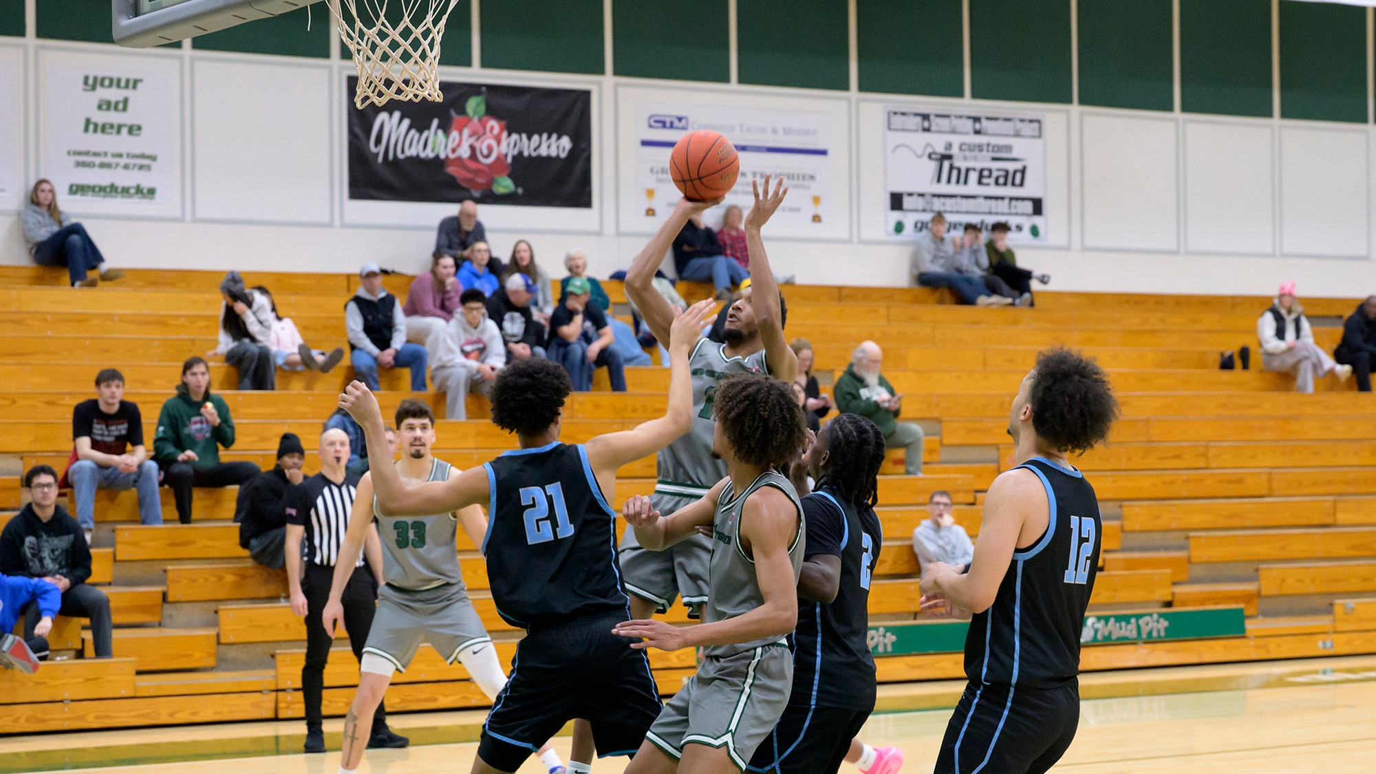 Kenzel Massey elevates to take a shot for Evergreen.