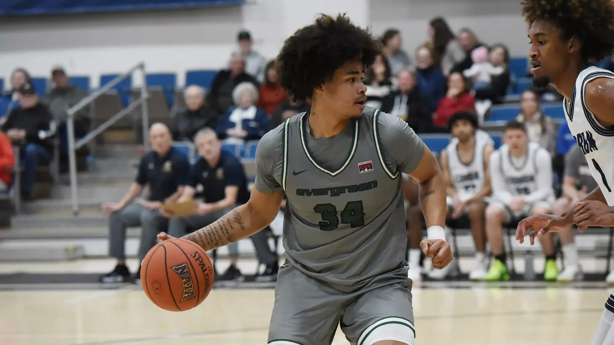 Kohrey Bridges dribbles the ball for the Geoducks.